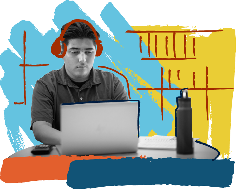 Madison College student wearing headphones using a laptop