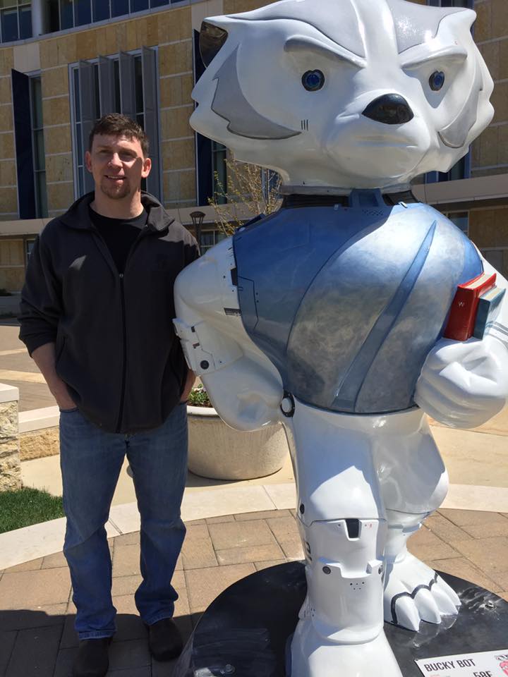 Jeff DeWitt stands with Bucky Bot.