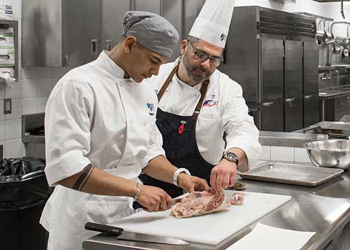 student learning how to prepare food