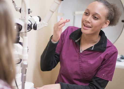 optometric student talking with patient