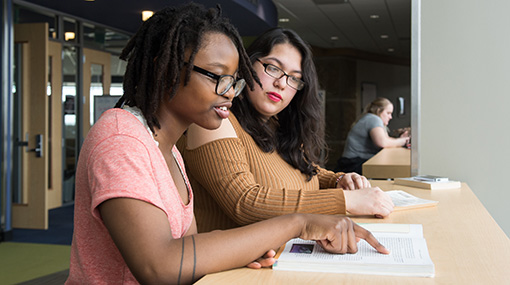 business students working on a project