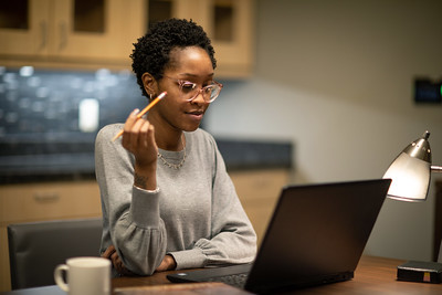 woman plans to take classes with coffee and laptop