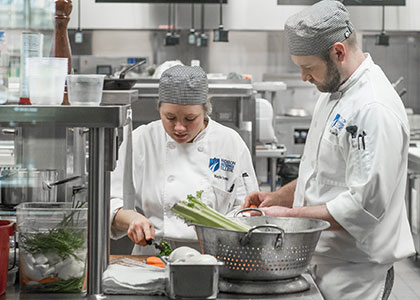 culinary production specialist program students at work in the kitchen