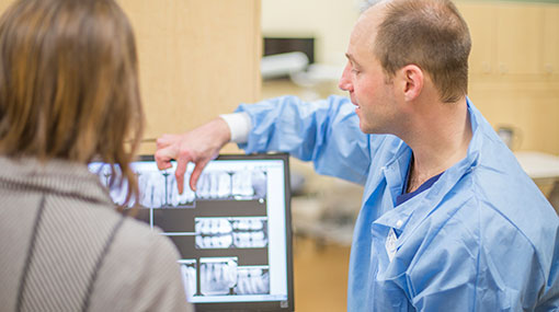 dental hygienist with a client