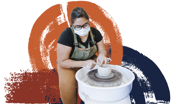 ceramics student with a pottery wheel